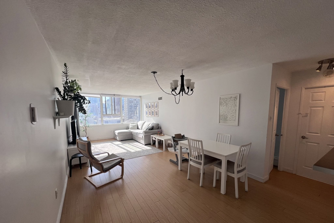 Dining and Living Room Open Concept - Furnished 2 bedroom / 2 Bathroom / 2 Den; in-unit Laundry, South Facing / Pool & Gym Condo