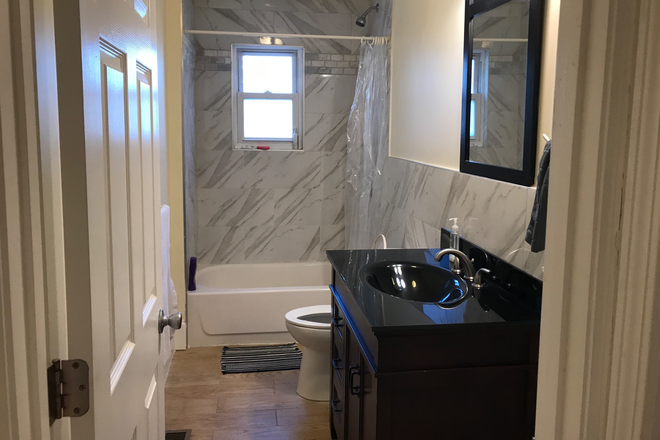 Bathroom with Stall - 205 Harvard St U1 Apartments