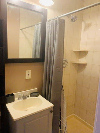 sink and shower - A quiet and peaceful dormer style apartment located in Levittown. Smoke, drug and pet FREE