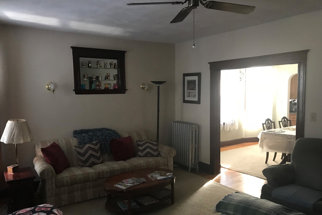 Living room and dining room - Private BR and office in spacious shared apartment in Brighton Ctr. triple decker for male co-tenant