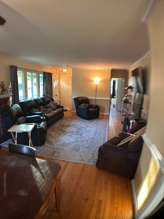 Living room with furnishings of previous tenant - Close + Spacious House--5 Bedrooms, 2 Baths  Available Now