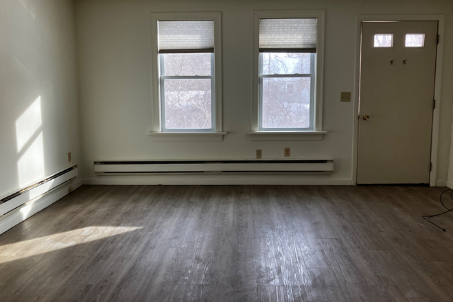 living room - July 1 One bedroom apartment - Amherst