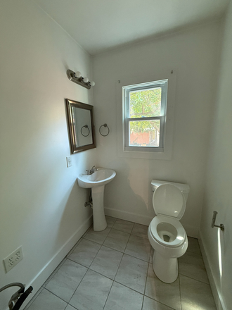First Floor Half Bath - Remington 5BR Rowhome Available 8/1 | Steps to JHU | Finished Basement Bed/Bath | 2,300 Sq Ft