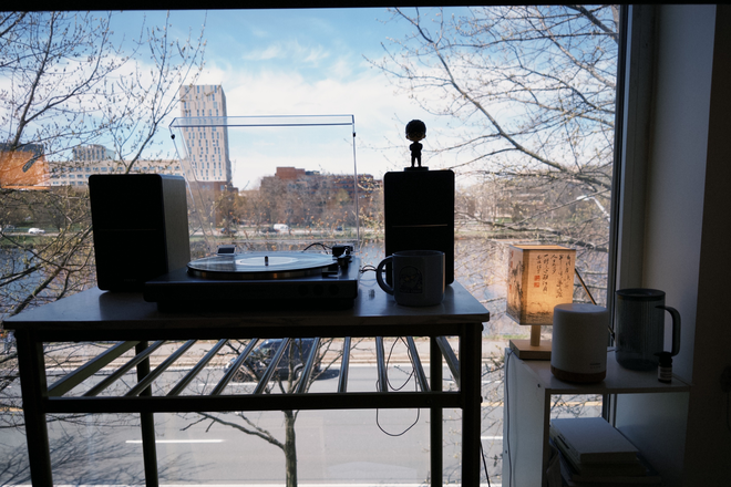 Bedroom 1, river view, record player. - 10 Akron 1BR Convertible — 2 Private Rooms, Furnished | May 15–Jul 9 Apartments