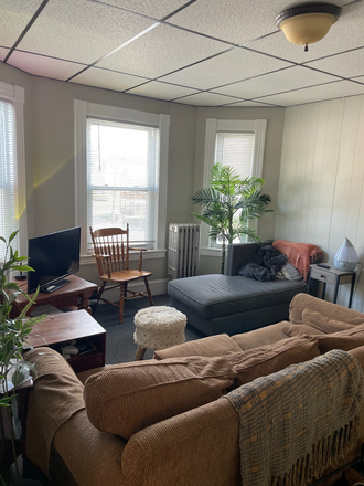 Living room - Looking for a 3rd Male Roommate / 2 returning Sr. Students. .5 miles to North Campus Duplex