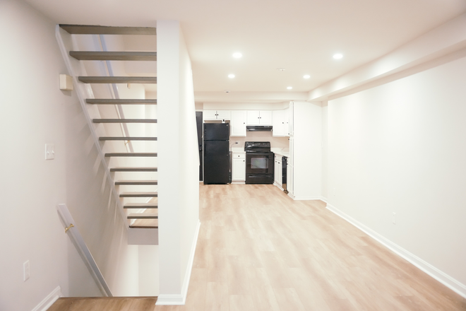 living room - Newly Updated 3BR/3BA Townhome w/ LVP, Modern Finishes — White Walls, Recessed Lights, Granite Tops