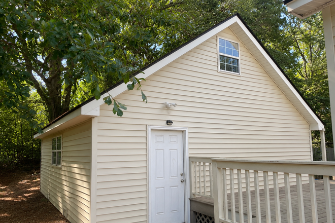 Front door and side deck entrance. - Beach Bungalow for rent close to folly beach and hospitals Apartments