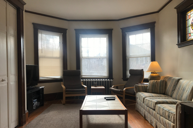 Living room. - SUNNY TWO BEDROOM APARTMENT CLOSE TO COMMUTER RAIL WITH ONE PRIVATE