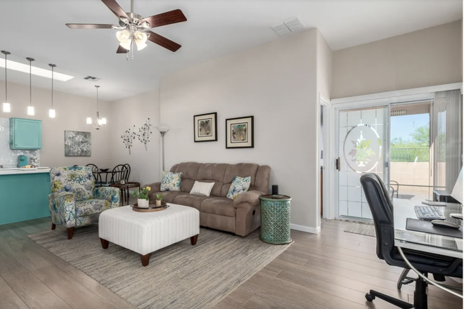 Living room area right when you walk in. The furniture is different, but the cabinets are Tiffany blue. - Houses