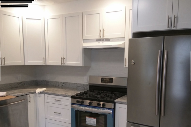 Kitchen - Modern home with an in-unit washer and dryer, located just 17 minutes from Tufts University.