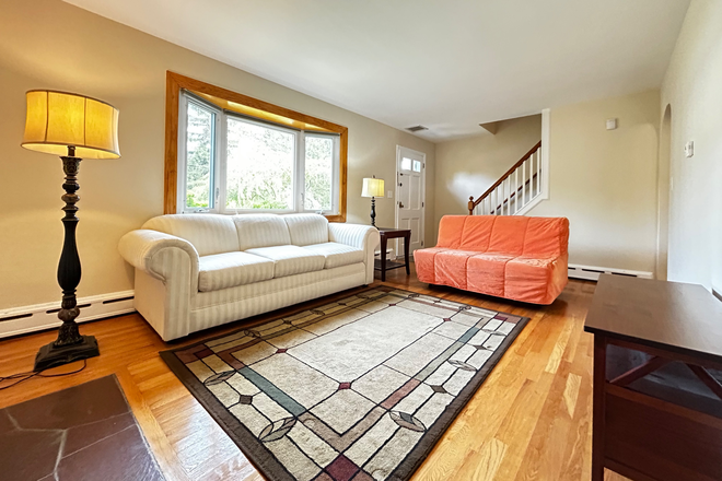 Family room with big window and reading lamps - Finished room in shared home for female only-Erdman Ave-Princeton