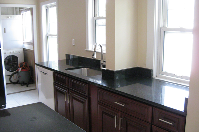 Bright Kitchen adjacent to laundry room in rear. - September 1st!! Two roommates wanted for a 5 bedroom Apartment near the Fletcher school!!