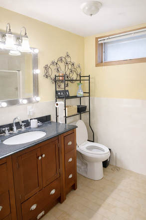 Full Bathroom with Standup shower - Furnished bright 1BR lower suite with windows throughout and a large kitchen Apartments