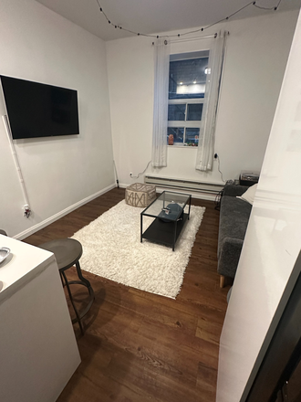 living room - Furnished 3 Bedroom, 1 Bathroom with Laundry in Kensington ChinaTown Neighbourhood