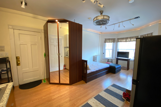 Armoire and main room - Studio on St Stephen St Apartments
