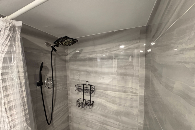 Shower in remodeled private bathroom - Furnished Ground Floor Remodeled Room w/Private bathroom– Walk to FAU Condo