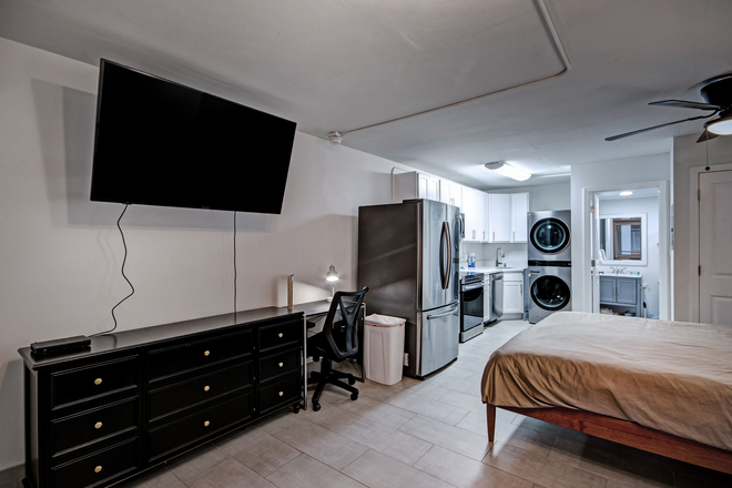 TV area/ Kitchen - FURNISHED unit Admiral Apartments