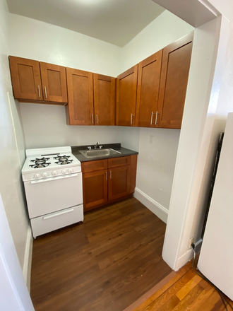 Hub Realty - Front facing studio with alcove, renovated kitchen, in Allston Apartments