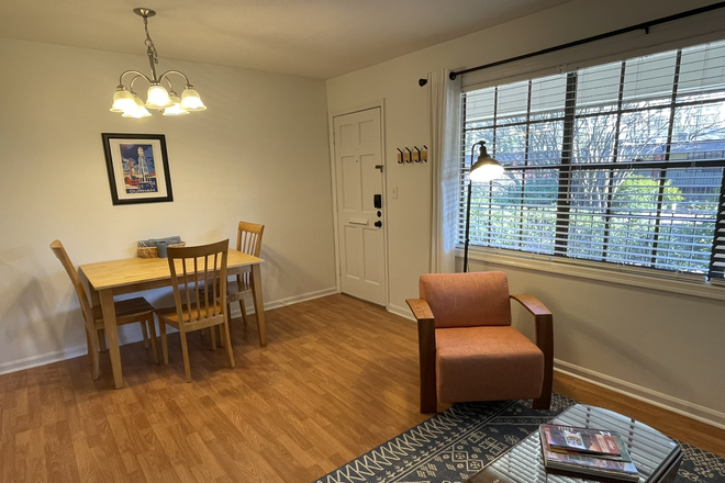 Living room and dining area - Quiet Condo Near Duke Campus and Facilities