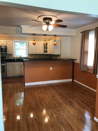 Dining into Kitchen - Spacious and Beautiful Home Close to Campus with Fenced in Backyard
