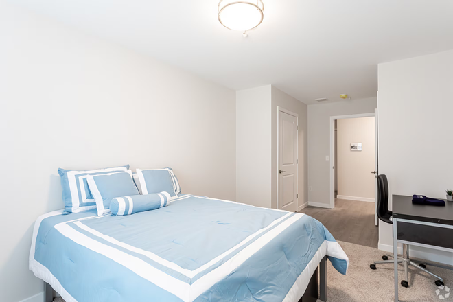 Bedroom with the included bed and desk (bed sheets not included) - Meadowbrook Gardens Apartment Available for SUBLET UNDER MARKET PRICE, With Shuttle To Campus
