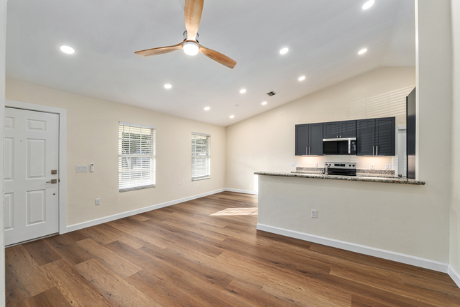 Open floor plan living room - Rare Find! Beautifully Remodeled 3BR/2BA Duplex in Turkey Creek Golf Course Community! Duplex