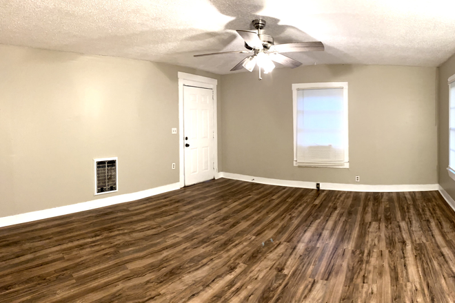 Living room - 2-BR townhome in quiet area-laminate, hookups, central location-water, lawncare included