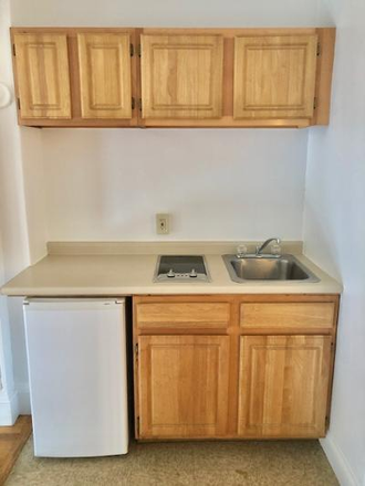 Visit hubrealtyproperties.com - Beautiful studio in clean brownstone, bay windows, street views, on the green line T Apartments