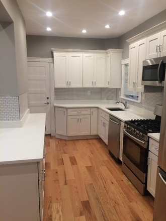 LIVING - UPDATED 3 BED WITH IN UNIT LAUNDRY AND PARKING INCLUDED!
