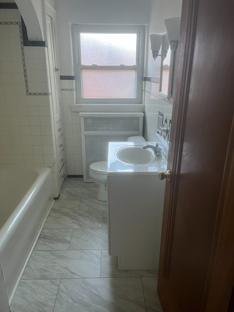 This is the first floor bathroom. - Hyde Park 2 family, upper unit available, 4 bedroom/2 bath Duplex