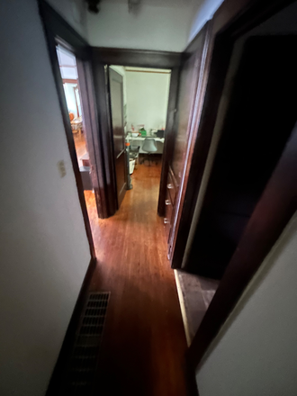 Hallway between bedrooms - Burgett Rentals House