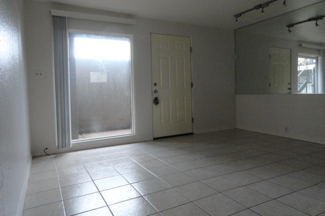 Living area - Small one-bedroom ; one-bath unit; 15 minute bicycle ride to campus (2.5 miles). Apartments