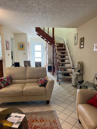 Living Room - SEEKING FEMALE STUDENT/YOUNG PROF. TO SHARE TOWNHOUSE NEAR UM AND METRO