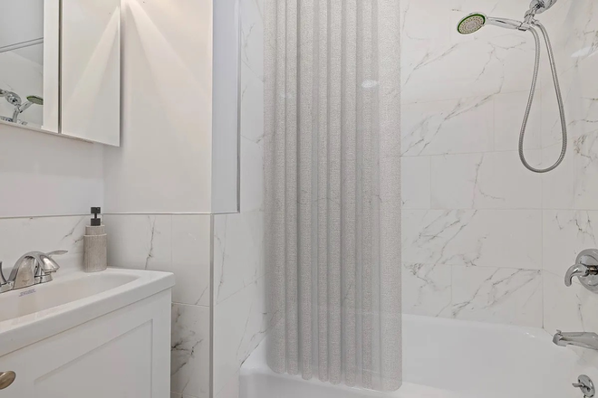 Bathroom (Different unit's) - Midtown apartment a stop away from campus