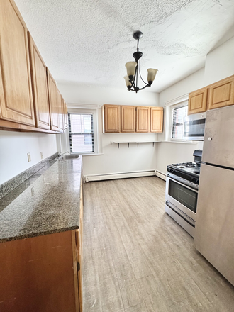 Kitchen - Modern 4 Bed in Mission Hill - Laundry in Unit - Pet Friendly! Apartments