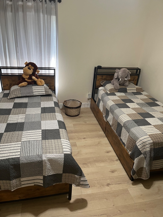twin beds shared room with drawers under the bed - Loving Home
