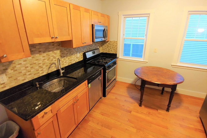 Eat -in Kitchen with new stove and dishwasher - No fees! Several bedrooms available in our 4 bedroom apartment near Red Line