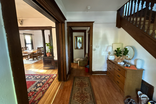 Downstairs Hallway View with Coat Closet and Staircase - Cute House Across Campus
