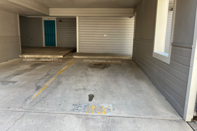 Parking space (on right) and unit door - CrownHill Apartments