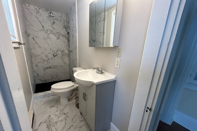 new bath - 3 bedroom apartment near Tufts with parking.