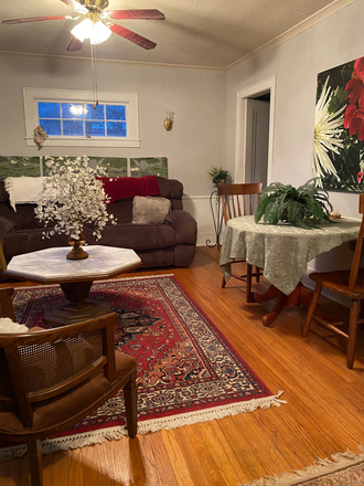 Common area: plush reclining couch, dining/study table, large screen apple TV, CDs, etc. - Lovely home for lucky grad students. 2-adjoining rooms, AVAILABLE NOW OR SPRING 2026