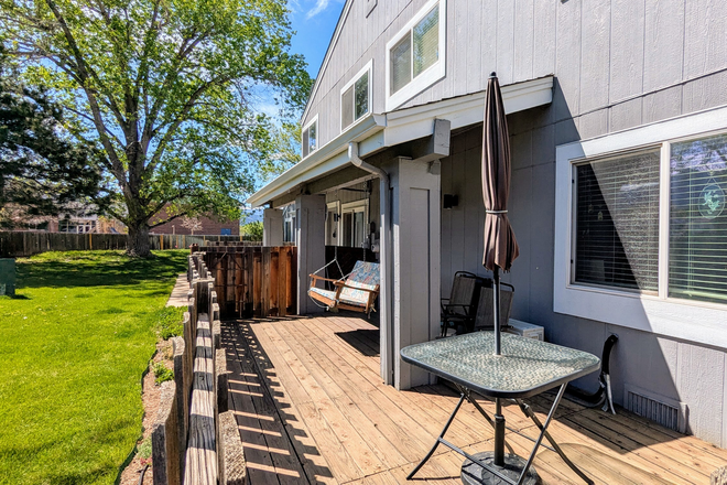 A Side View of the Redwood Deck and note adjacent Greenbelt that is private - Panoramic Views of Flat Irons with this Beautiful 2BR 1150 SQFT Townhome Rental next to CU Campus