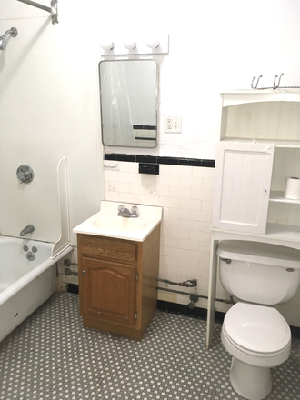 Visit hubrealtyproperties.com - Handy front facing one bedroom split with decorative fireplace, in Allston Apartments