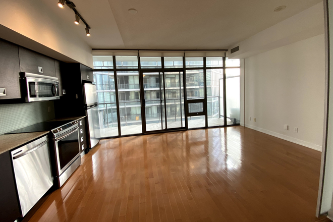 Kitchen and Living room - Modern 1BR at Yonge & Bloor – Steps to U of T St. Gorge Professional Schools