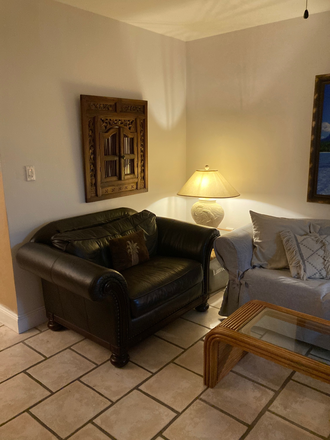 Living room - Handsome furnished apartment in tropical setting right  across from Biscayne Bay .