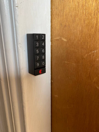 electronic lock outside apartment door - Fully furnished first floor apt. in Harvard Square including all utilities.