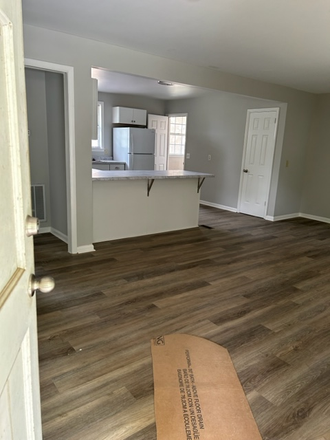living room into kitchen - Totally renovated duplex with garage off White Bridge Road