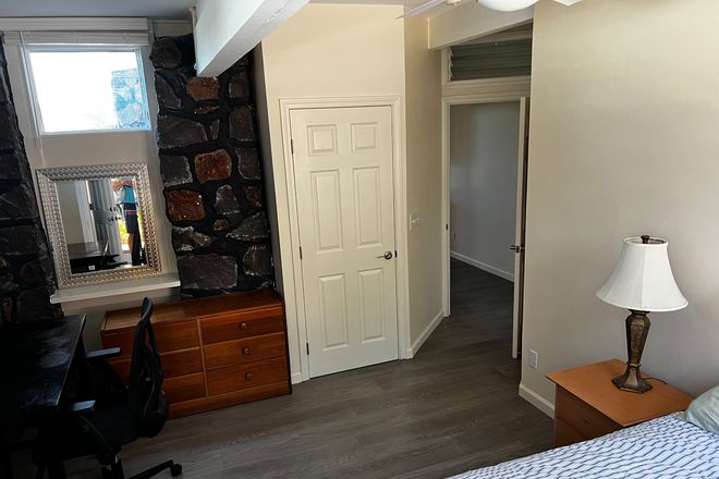 Bedroom showing closet #1 (includes dresser, mirror, desk with chair) - Manoa Manor