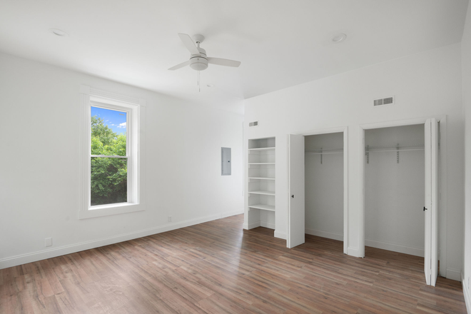 Cozy sleeping area with space for a full bed and nightstand. - Modern Studio Steps from UC – Available Now! Apartments