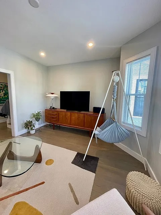 living room - Gorgeous townhouse, 5bd/3ba, 4 parking spaces and steps to Boston Landing commuter rail station